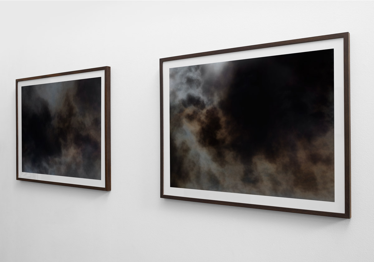 Installation view of two fine art photograph from the “Wildfire" exhibition in Copenhagen by photographer Kenneth Rimm. Viewed from left side.