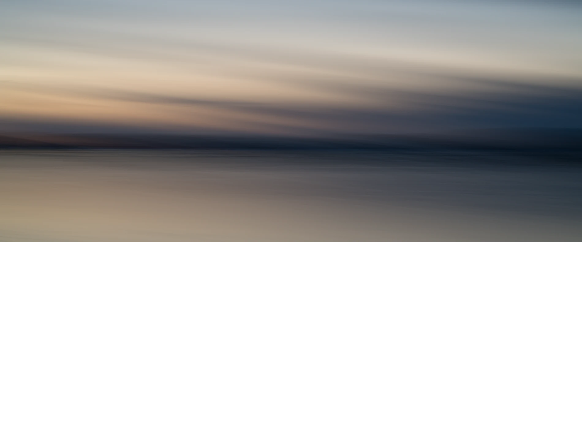 Abstract-seascape-panorama-color-art-copyright-photographer-Kenneth-Rimm-2 Contemporary abstract seascape panoramic photograph in warm muted colors and muted dark ocean blue / steel blue colors from the twilight sky reflecting in the ice covered water, from the Liquid Light seascapes series by fine art photographer Kenneth Rimm.